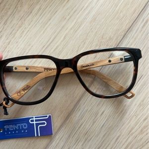 Handmade glasses with non-prescription lenses. Wooden sides.